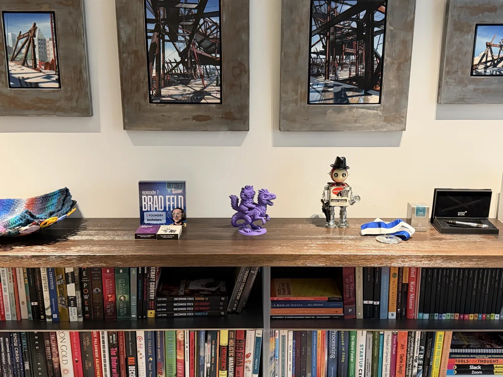 The shelf in my office - Donut and Mongo, a wind-up robot, and a few hundred books underneath